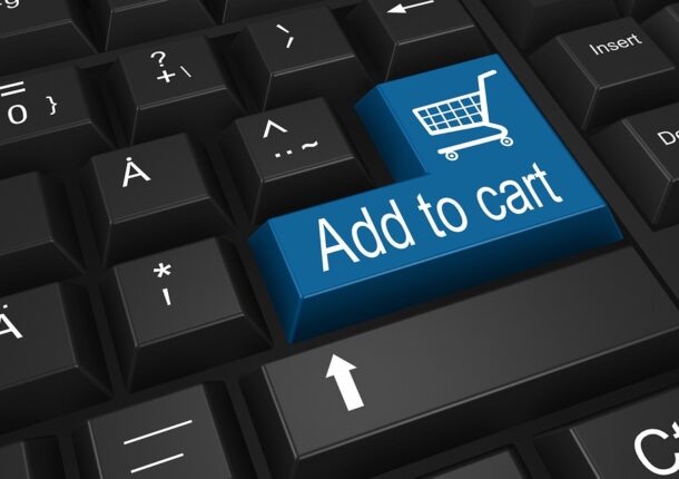 An “Add to cart” button on a keyboard, symbolizing Shopify vs. WordPress differences.