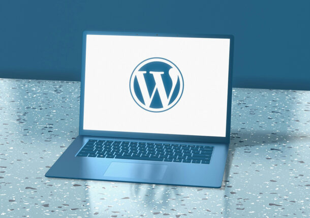A laptop displaying the WordPress logo